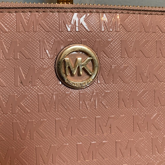 Authentic soft pink patent leather large wristlet clutch by Michael Kors
